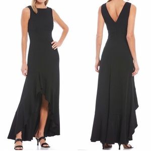 Vince Camuto
Crew Neck Sleeveless V-BackHigh-Low Ruffle Hem
Gown size 12 motb